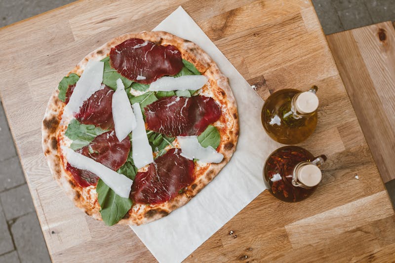 The Gold Standard specialty pie with truffle oil and prosciutto