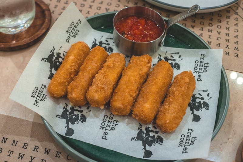 Golden fried Mozzarella Sticks with marinara dipping sauce