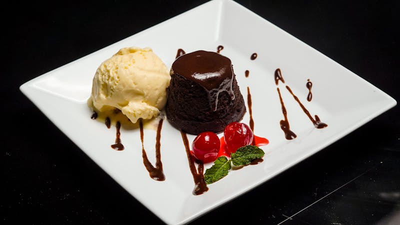 Chocolate Lava Brownie warm and gooey served with vanilla ice cream