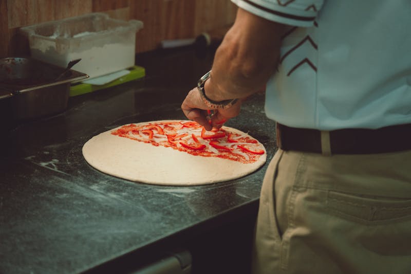 Pizza Ranch kitchen interior with artisan pizza preparation